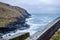 Dark, black steep cliffs on the sea