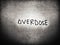 on the dark black and white color background art the word overdose