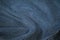 Dark blue corduroy surface texture. Elegant background with space for design. Natural cotton ribbed fabric.