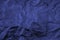 Dark blue crushed fabric background