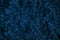 Dark blue grunge textured background of pressed wood chips