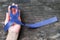 Dark blue ribbon symbolic for colon - colorectal cancer and Acute Respiratory Distress Syndrome ARDS awareness on hand