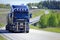 Dark Blue Scania R580 Trucking Uphill at Summer