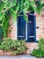 Dark Blue Window Shutters on Traditional Stone Greek House