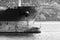 Dark bow of a big industrial cargo ship, black and white