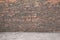 Dark brick wall and cobblestone floor