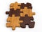 Dark and bright wooden jigsaw pieces