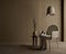 Dark brown living room with wicker chair,side table,lamp and vase on dark wall background.