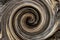Dark brown round twirl abstract background