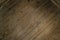 Dark brown wooden background with parallel slanted lines