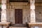 Dark brown wooden door at Nandi Monolith temple, Hampi, Karnataka, India