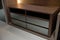 Dark brown wooden shelf furniture that is multi-functional