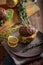 Dark burger with grain bread, salad, rosemary and lemon