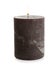 Dark burning decorative candle isolated