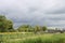 Dark c umulus clouds above the meadows and agriculture fields in the Zuidplaspolder in the Netherlands