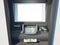 Dark cash machine on a bright wall. 3d rendering