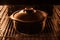 Dark cast iron pot in the electric oven