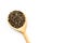 Dark chia seeds in wooden spoon on white background top view copyspace