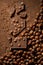 Dark chocolate background by hazelnut chocolate pieces, whole filberts and cocoa powder