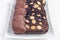 Dark chocolate biscotti cookies with almonds, covered with melted chocolate, horizontal