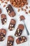 Dark chocolate biscotti cookies with almonds, covered with melted chocolate, vertical, top view