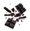 Dark chocolate explosion, pieces shattering on background