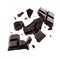Dark chocolate explosion, pieces shattering on background