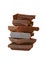 Dark chocolate. Stacked tower, stack. Seen close.  White background. Chocolate construction. Small pieces of chocolate bar. Pieces