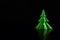 Dark Christmas and crisis concept. Christmas tree in dark black background.