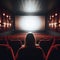 Dark cinema with audience waiting in anticipation, with black white screen