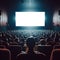 Dark cinema with audience waiting in anticipation, with black white screen