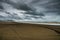 Dark Cloud Formation Over Vast Sand Beach During A Stormy Day In Long Beach Washington