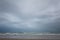 Dark clouds above the beach