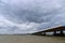 Dark clouds above the Moerdijkbrug over water named Hollands Diep