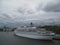 Dark clouds are cover luxury cruiser ship in port.