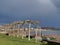 Dark clouds following sunshine at coatline of river Rhine