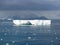 Dark Clouds over arched iceberg Antarctica