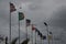 Dark clouds over the flags of different countries.