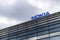 Dark clouds over Nokia logo on top of a building