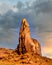 Dark clouds over the Thumb, a massive Red Sandstone Formation in Monument Valley