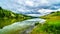 Dark Clouds and surrounding Mountains reflecting on the smooth water surface of Trapp Lake