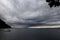 Dark clouds of thunderstorm over Lake Garda near Garda