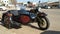 Dark colored motorcycle with sidecar parked