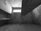 Dark concrete basement room interior with exit light. Architecture concept