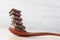 Dark cooking chocolate chunks on wooden spoon with copy space