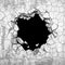 Dark cracked broken hole in concrete wall. Grunge background