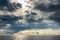 Dark cumulus clouds hovering over sea