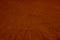 Dark deep burnt orange red brown terracotta texture background. Wrinkled crumpled natural cotton fabric cloth. Color.