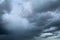 Dark dramatic sky and clouds. Background for death and sad concept. Gray sky and fluffy white clouds. Thunder and storm sky. Sad