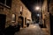 Dark and eerie urban city cobblestone brick alley at night